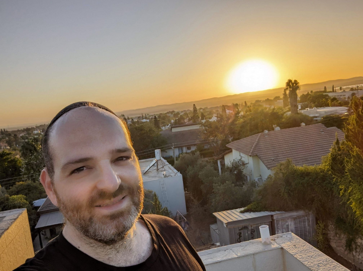 A picture of me at sunset with a view of Meitar